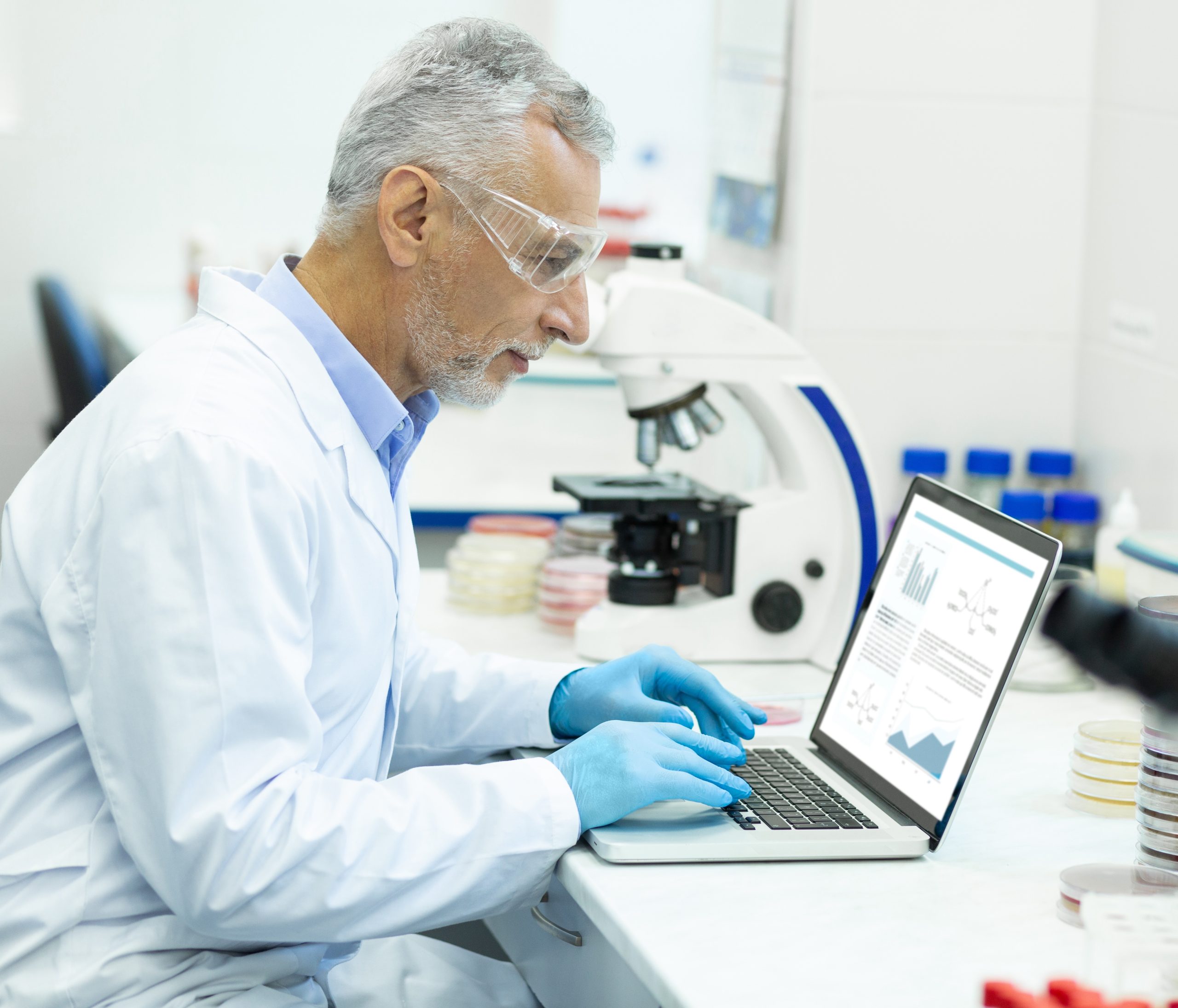 Scientific,Project.,Serious,Grey-haired,Man,Sitting,In,Semi,Position,And